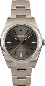 Used Rolex Oyster Perpetual 114300 Dark Rhodium w/ Blue Accents