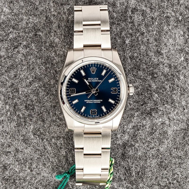 Unworn Rolex Oyster Perpetual 114200 Blue Index Dial