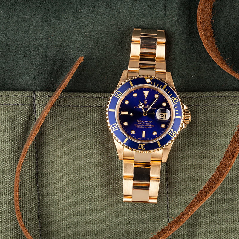 rolex submariner yellow gold green dial