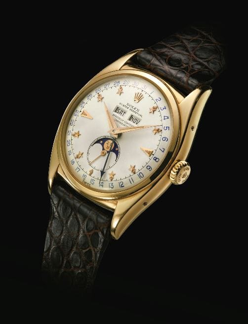 yellow gold automatic triple calendar Rolex wristwatch