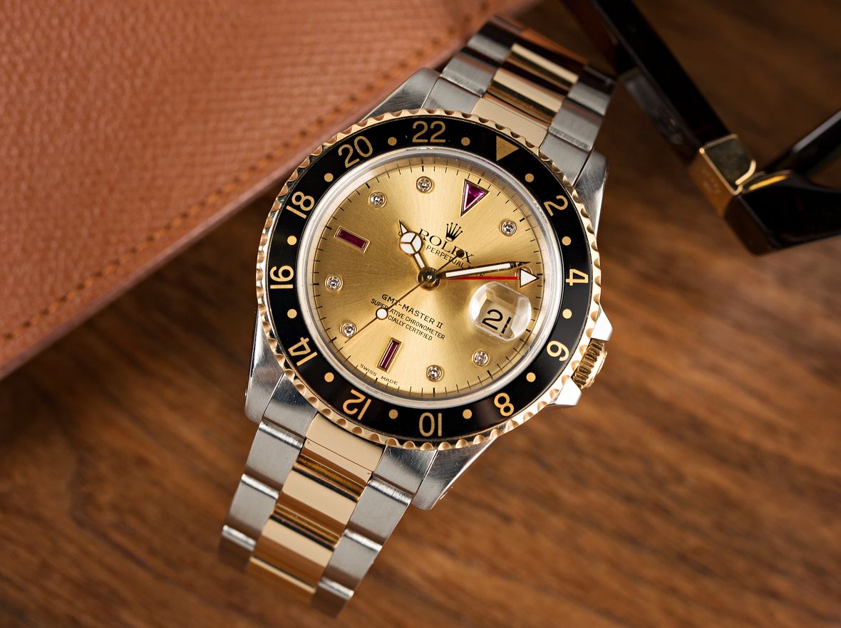 Rolex GMT-Master II Two-Tone 16713 Serti Dial Diamond Ruby