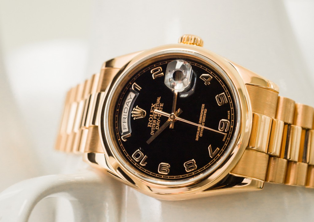 This Day-Date comes with arabic numbers. Rolex Day-Date 118205