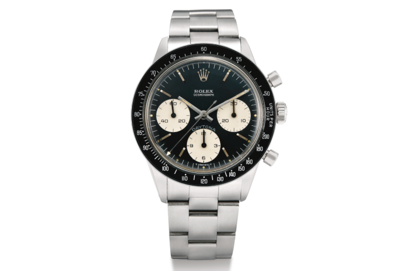 Note the matching black dial features the white subsidiary dials and the “DAYTONA” label above the 6 o’clock subdial Rolex Cosmograph Daytona ref. 6264/6239 (Image courtesy of Sotheby's)