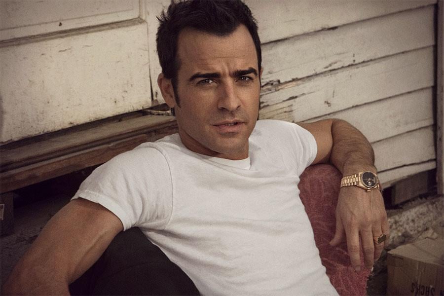 Justin Theroux wearing his yellow gold Rolex Day_Date President with a black dial