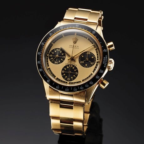 The all black and gold construction of this timepiece get the name "John Player Special" Rolex-Daytona-Paul-Newman-6241-gold