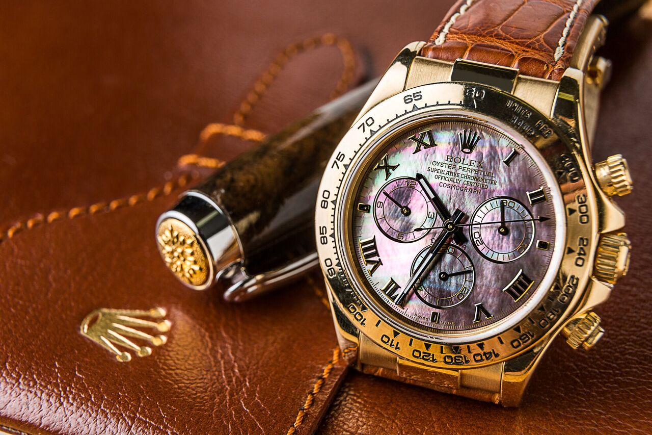 Rolex Daytona gold mother of pearl watch 