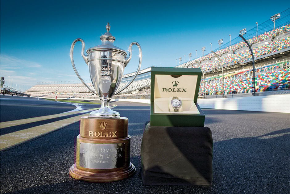 Jeff Gordon wins the checkered flag and gets a two-tone Daytona. Jeff Gordon comes in and takes the trophy home.