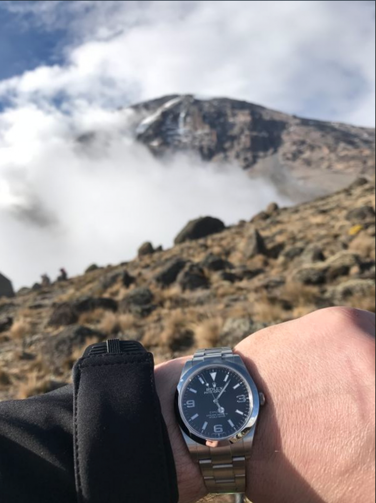 An Explorer at the summit of Kilimanjaro