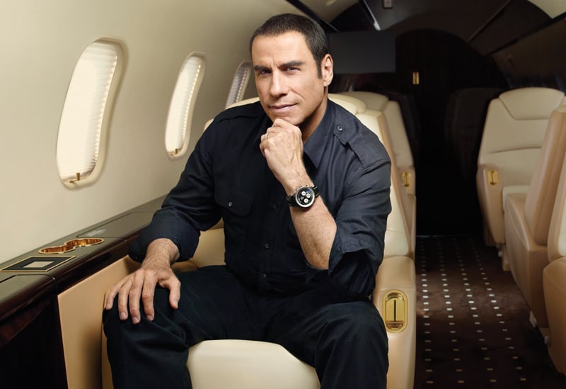 Travolta wearing a Navitimeter on his Challenger plane