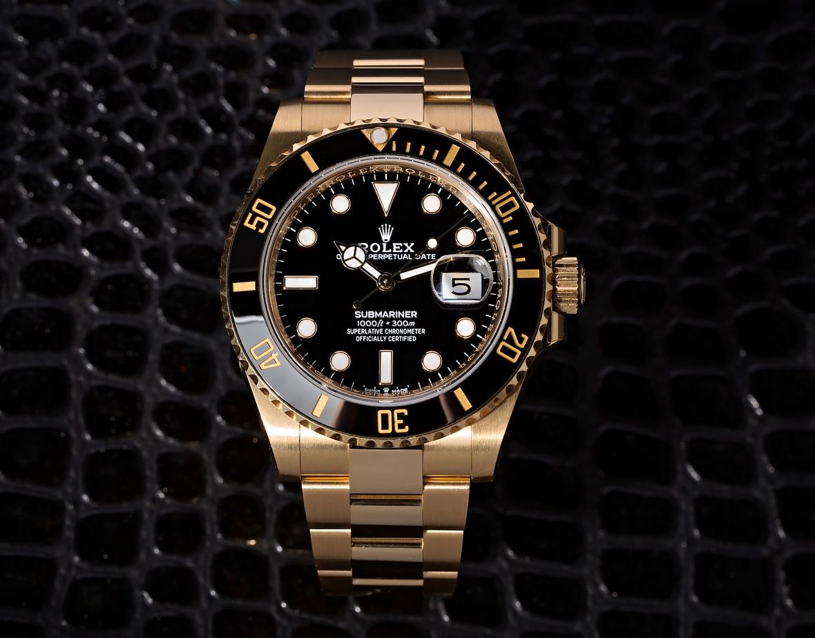 Gold Rolex Submariner History 116618LN Black Bezel