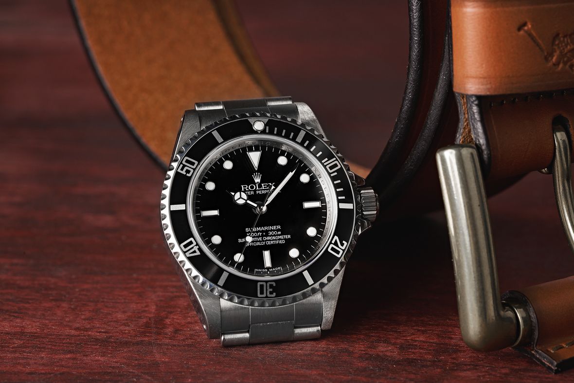 How to tell what Rolex Submariner series 114060M 4-line dial