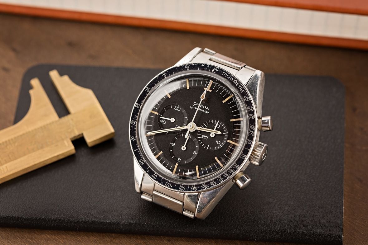 Vintage Omega Speedmaster shoot on top of an old riveted Louis