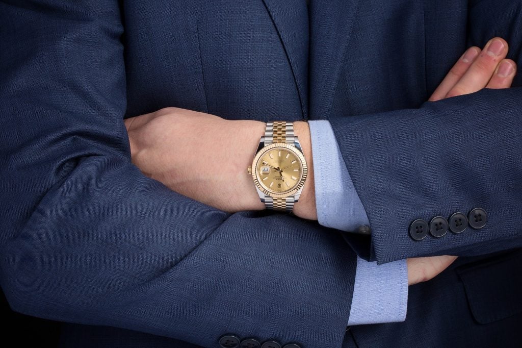Rolex Datejust on wrist with suit